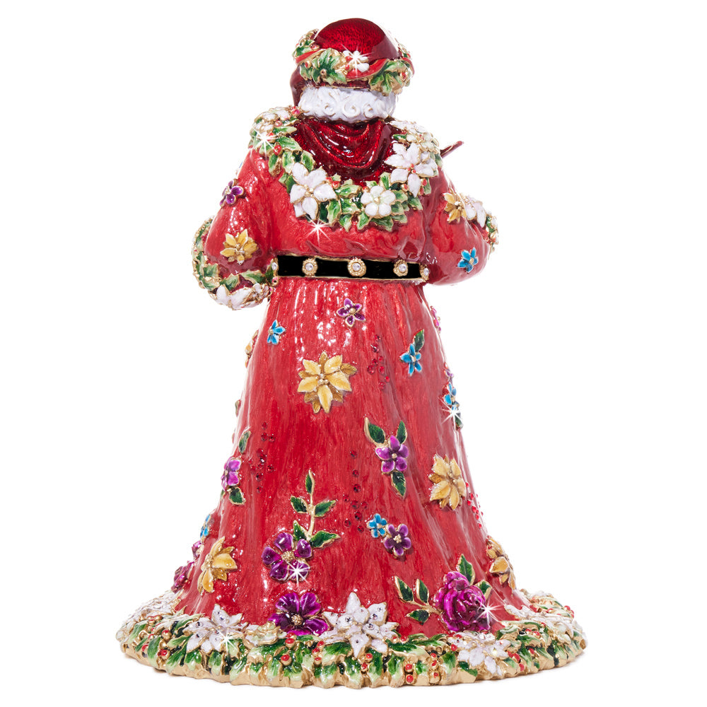 Floral Santa. Features intricate details, a red robe adorned with white poinsettias and jewel-toned floral embellishments, accented with 14k gold. View of back.