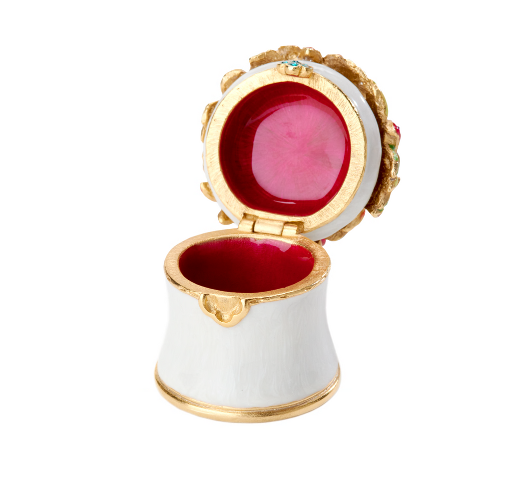 Cameryn Mini Bouquet Box. Features a white enamel flower box with a bouquet of flowers within. View of red enamel on inside.