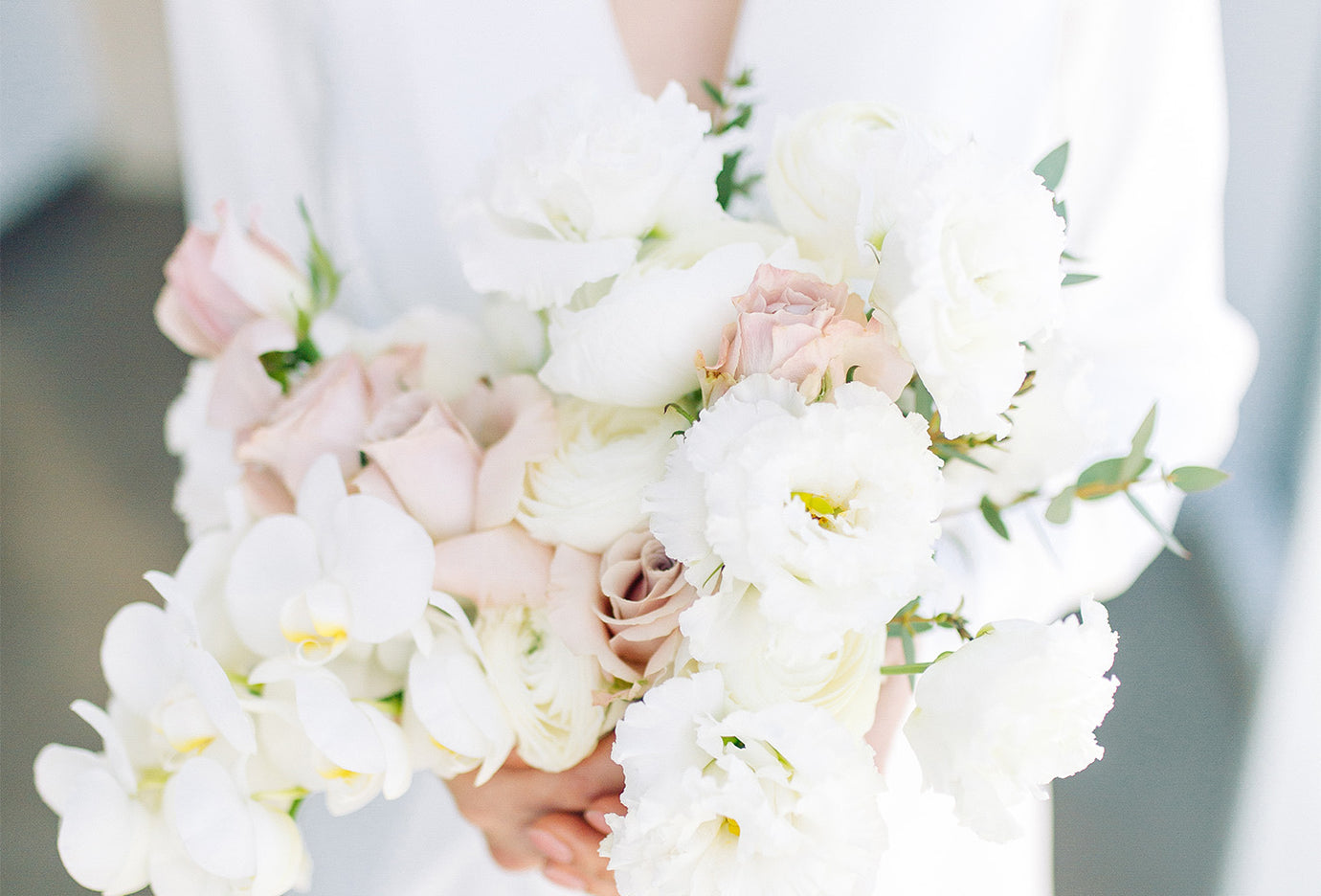 A person holding a bouquet of flowers