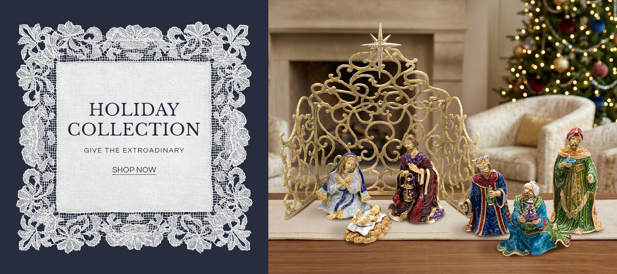 Holiday Collection banner featuring a ornate gold filigree nativity scene set with Mary, Joseph, baby Jesus, and the Three Wise Men in front of a cozy fireplace and Christmas tree, alongside text reading "HOLIDAY COLLECTION - GIVE THE EXTRAORDINARY - SHOP NOW".